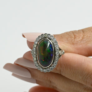 Edwardian Black Opal Cabochon and Diamond Halo Vintage Platinum Ring