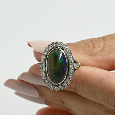 Edwardian Black Opal Cabochon and Diamond Halo Vintage Platinum Ring