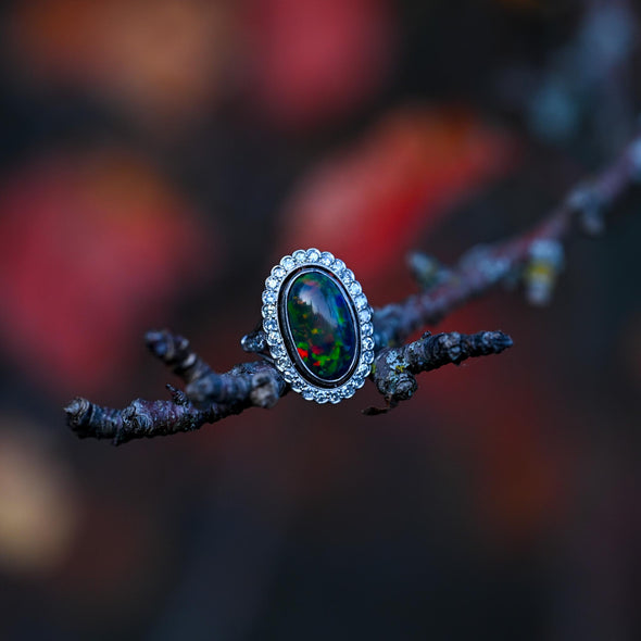 Edwardian Black Opal Cabochon and Diamond Halo Vintage Platinum Ring