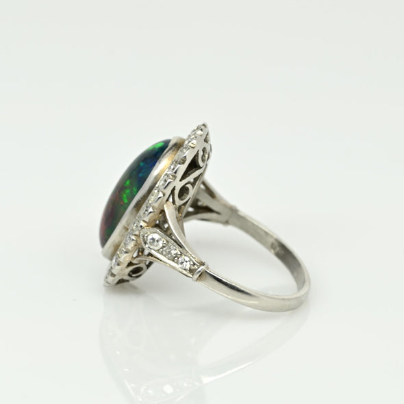 Edwardian Black Opal Cabochon and Diamond Halo Vintage Platinum Ring