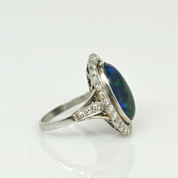 Edwardian Black Opal Cabochon and Diamond Halo Vintage Platinum Ring