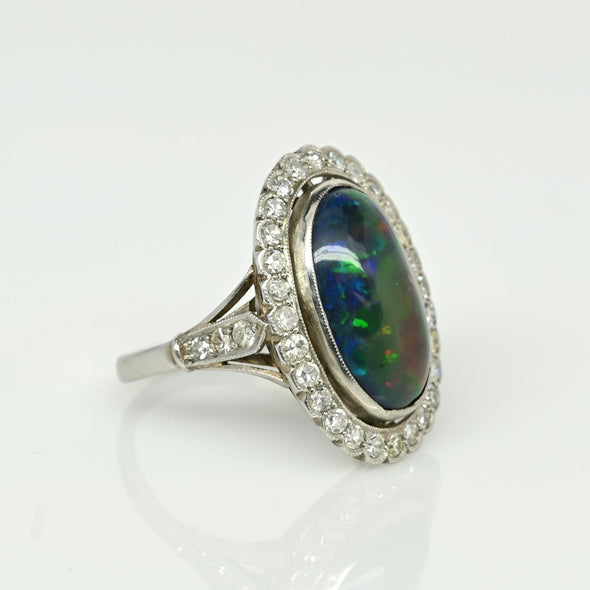 Edwardian Black Opal Cabochon and Diamond Halo Vintage Platinum Ring