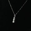 Timeless Three-Stone Diamond Necklace in White Gold