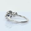 Blue Sapphire and Diamond Three Stone Halo 14k White Gold Ring