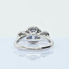 Blue Sapphire and Diamond Three Stone Halo 14k White Gold Ring