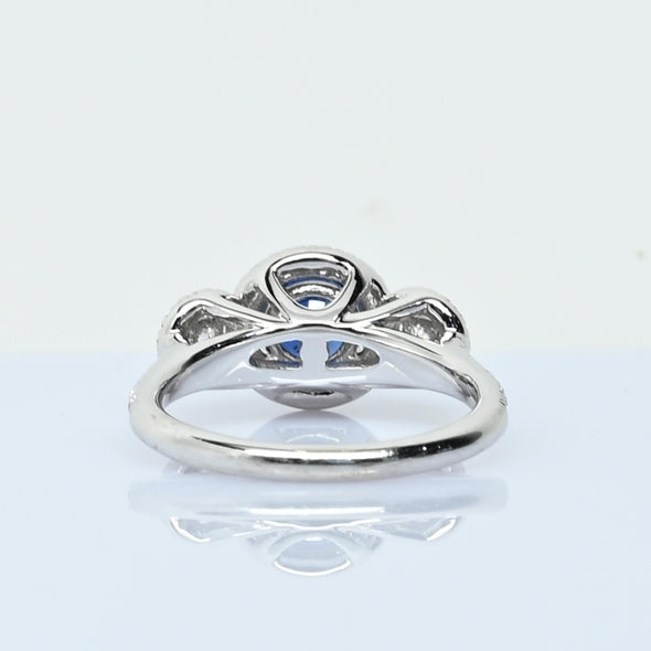 Blue Sapphire and Diamond Three Stone Halo 14k White Gold Ring