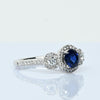 Blue Sapphire and Diamond Three Stone Halo 14k White Gold Ring