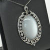 Edwardian 29ct Oval Moonstone Diamond Bow Motif Platinum Pendant