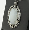 Edwardian 29ct Oval Moonstone Diamond Bow Motif Platinum Pendant
