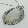 Edwardian 29ct Oval Moonstone Diamond Bow Motif Platinum Pendant