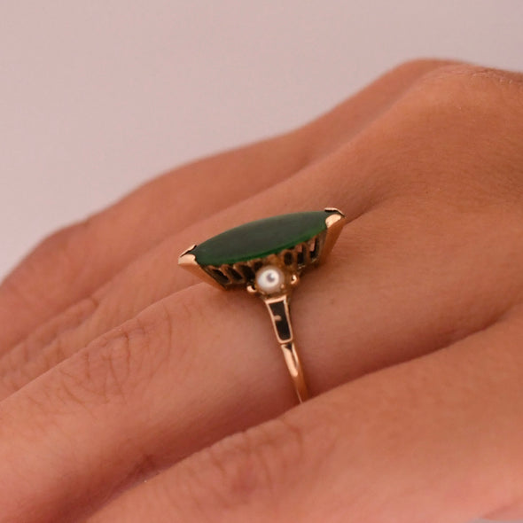 Retro 14K Yellow Gold Green Jade Navette and Pearl Accent Three Stone Fashion Ring on the hand giving a side profile 