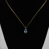 Blue Topaz Oval and Diamond Pendant on Chain in 14K Yellow Gold