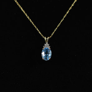 Blue Topaz Oval and Diamond Pendant on Chain in 14K Yellow Gold