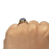 Victorian 18K Yellow Gold Egyptian Hallmarked Blue Synthetic Oval Vintage Unisex Engagement Ring on the hand from the back  looking at the height 
