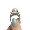Edwardian Platinum Hand Made Vintage Mount with Large Cultured Pearl in the hand showing the overall design 