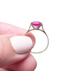 Vintage 18K Yellow Gold Solitaire Pink Gem Engagement/Statement Ring in the hand highlighting the minimalist gallery 