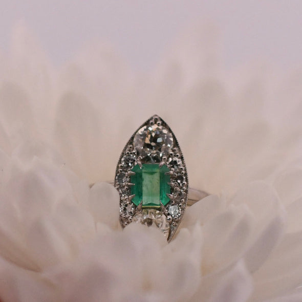Circa 1920's Three Stone Navette Diamond and Colombian Emerald Ring