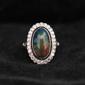 Edwardian Black Opal Cabochon and Diamond Halo Vintage Platinum Ring