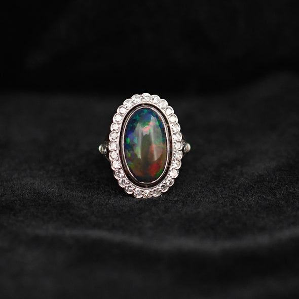 Edwardian Black Opal Cabochon and Diamond Halo Vintage Platinum Ring