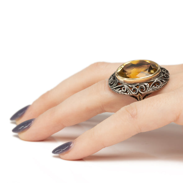 Victorian Two Tone 18K and Sterling Silver Antique Large Oval Citrine Cocktail/Statement Ring on the hand giving a side profile 