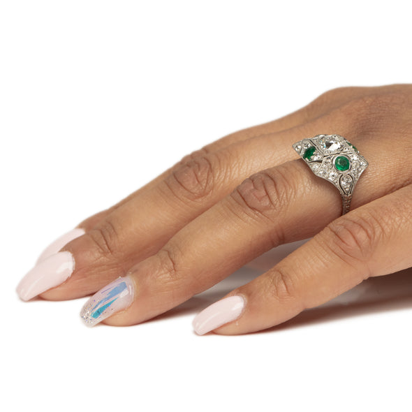 Edwardian Platinum Old Mine Cut Center with Natural Emerald Accents Vintage Statement Ring on the hand giving a breath taking side profile highlighting the shape 