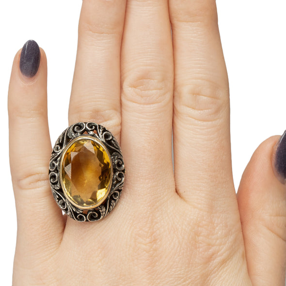 Victorian Two Tone 18K and Sterling Silver Antique Large Oval Citrine Cocktail/Statement Ring on the hand from the top showcasing the overall size and look 