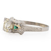 Art Deco 18K White Gold Illusion Head 1.36Ct Old European Cut Diamond w/Emerald Accents Vintage Engagement Ring from the right shoeing off the side profile and emerald details 