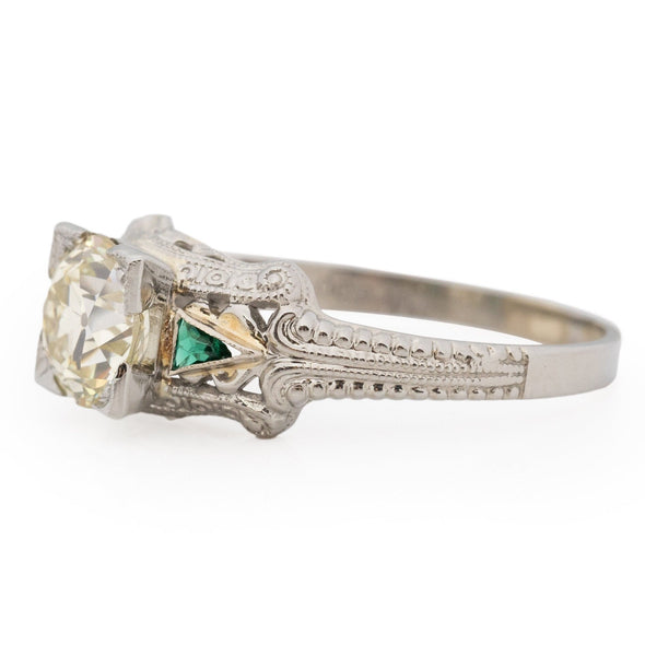 Art Deco 18K White Gold Illusion Head 1.36Ct Old European Cut Diamond w/Emerald Accents Vintage Engagement Ring from the right shoeing off the side profile and emerald details 