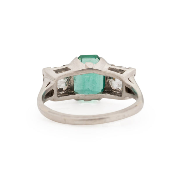 Art Deco Platinum GIA Certified F1 Natural Zambian Emerald and Diamond Three Stone Engagement/Statement Ring from the bottom peaking under the gallery 
