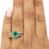 Art Deco Platinum GIA Certified F1 Natural Zambian Emerald and Diamond Three Stone Engagement/Statement Ring on the hand from the top looking down at the overall look 