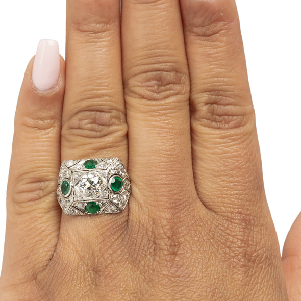 Edwardian Platinum Old Mine Cut Center with Natural Emerald Accents Vintage Statement Ring on the hand from the top showing off the overall look 