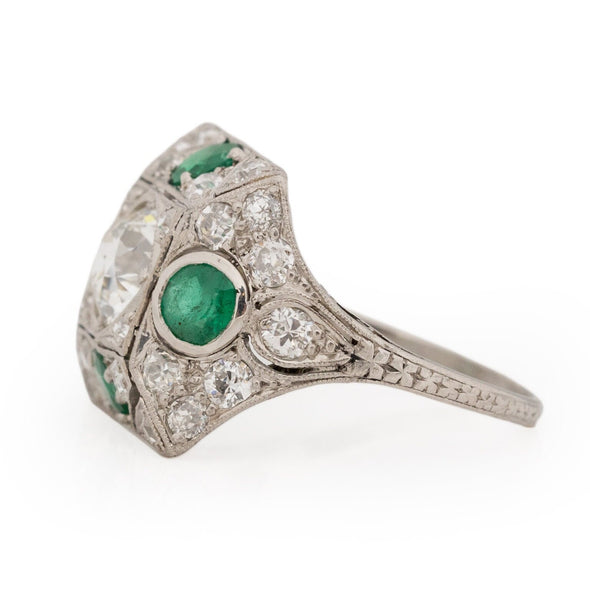 Edwardian Platinum Old Mine Cut Center with Natural Emerald Accents Vintage Statement Ring highlighting the emerald and diamond details 