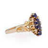 Victorian Style 14K Yellow Gold Deep Blue Gem and Seed Pearl Vintage Fashion Ring with Scroll Work from the left highlighting the scrolling shank details 