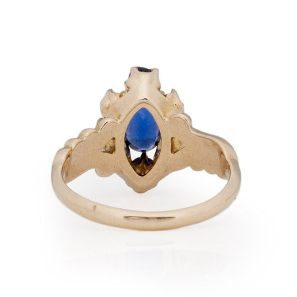 Victorian Style 14K Yellow Gold Deep Blue Gem and Seed Pearl Vintage Fashion Ring with Scroll Work from the bottom peaking under the gallery 