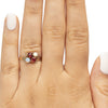 Victorian 10K Yellow Gold Antique Opal and Garnet Split Shank Four Stone Vintage Fashion Ring on the hand from the top highlighting the overall look 