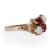 Victorian 10K Yellow Gold Antique Opal and Garnet Split Shank Four Stone Vintage Fashion Ring from the left showing off the scroll shank design 