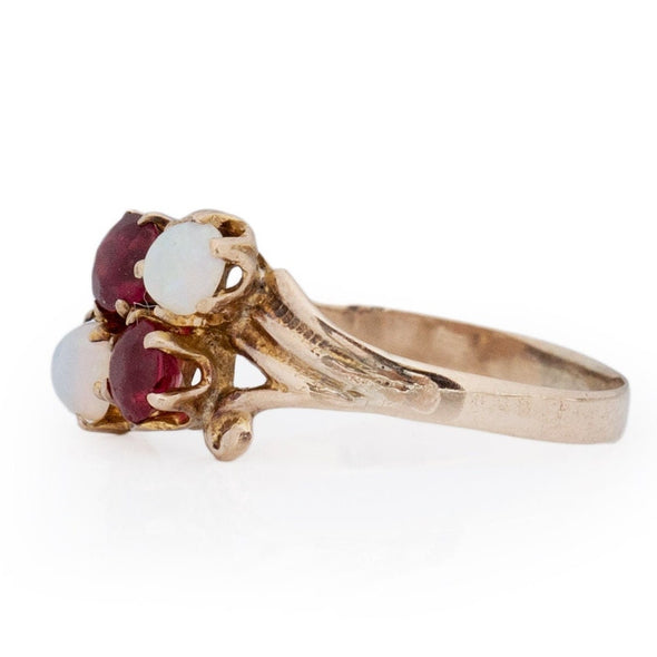 Victorian 10K Yellow Gold Antique Opal and Garnet Split Shank Four Stone Vintage Fashion Ring from the right show casing the prong setting 