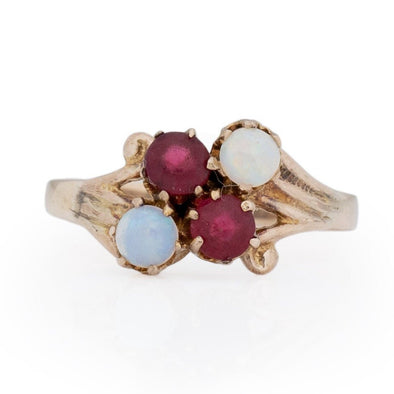 Victorian 10K Yellow Gold Antique Opal and Garnet Split Shank Four Stone Vintage Fashion Ring from the front highlighting the overall shape 