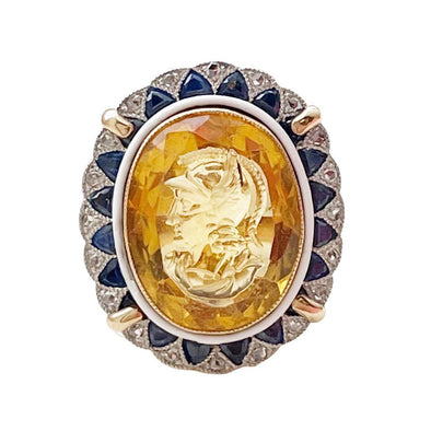 Edwardian 14K Yellow Gold and Platinum Citrine Carved Cameo with Diamond and Sapphire Halo Scalloped Edge Cocktail Ring from the front showing off the overall design 