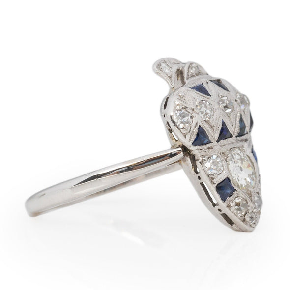 Edwardian 14K White Gold Old European Cut Diamond and Blue Sapphire Acorn Cocktail Ring from the left highlighting the tapered shanks 