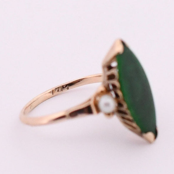 Retro 14K Yellow Gold Green Jade Navette and Pearl Accent Three Stone Fashion Ring from the left peaking at the hallmarks inside the shanks 