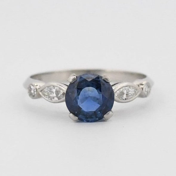 Art Deco Platinum Rich Blue Round Brilliant Cut Natural Sapphire Solitaire Engagement Ring from the front showing off the sapphire shape and setting 