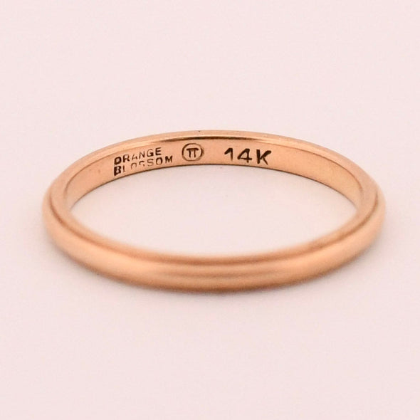 Art Deco 14K Yellow Gold Orange Blossom Smooth Finish Comfort Fit Mens Stackable Wedding Band peaking inside the band looking at the hallmarks 